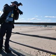 New York Daily News photographer Todd Maisel shooting a crime scene at Coney Island.